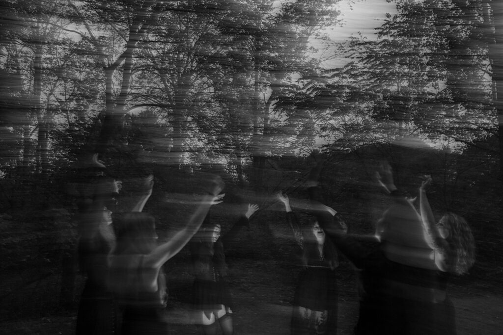 Women dancing around a fire summoning their darkest powers.