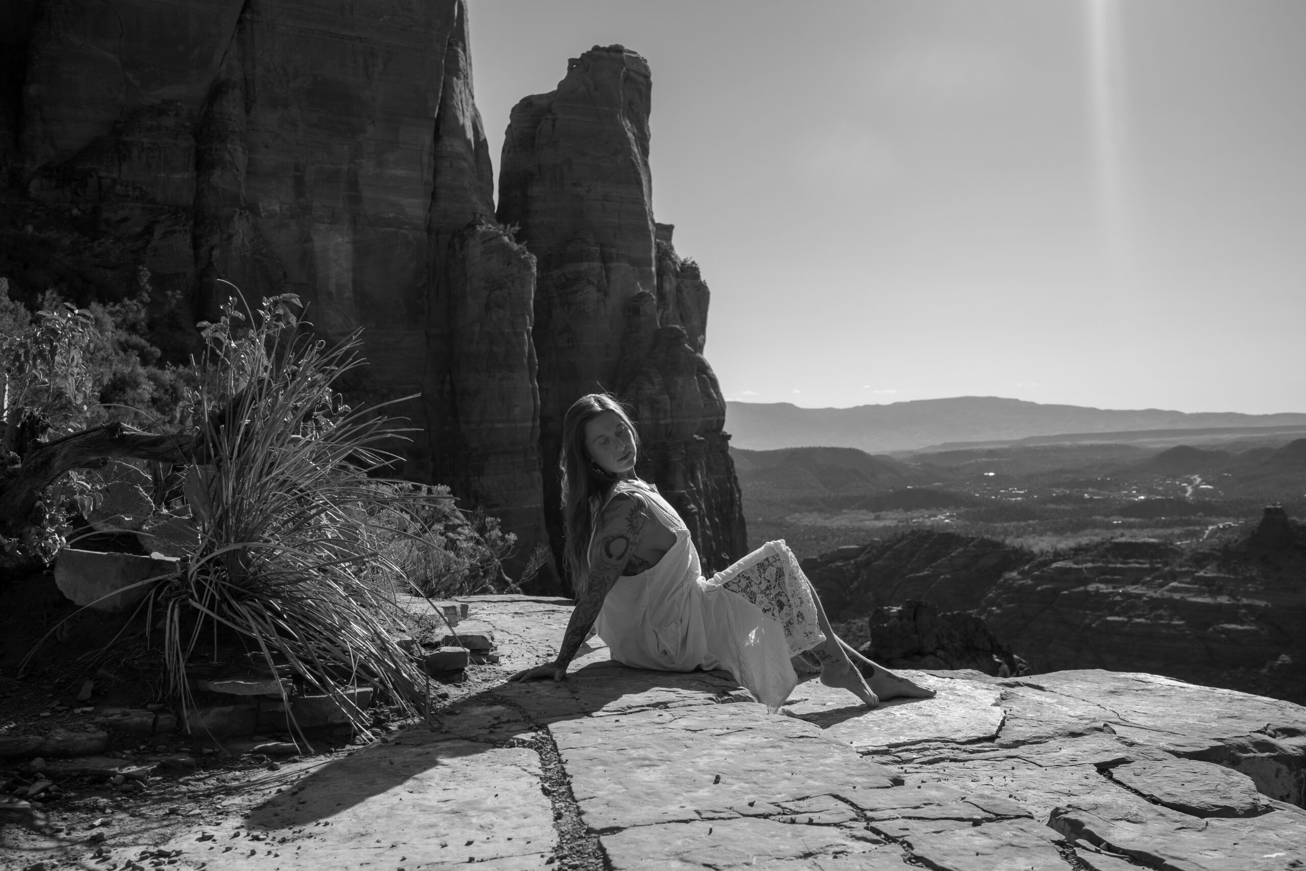 Destination boudoir photography in Arizona red rock landscape at sunrise